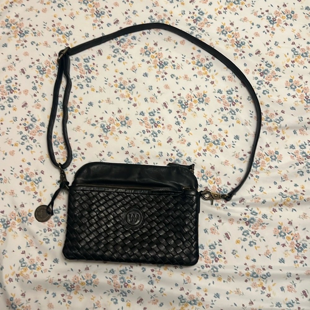 Wanderers Travel Co. black crossbody woven full grain leather bag. “The Murano”